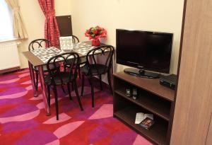 TV a/nebo společenská místnost v ubytování Anyday Apartments