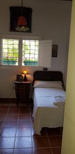 Postel nebo postele na pokoji v ubytování Cortijo de Mariangela tres