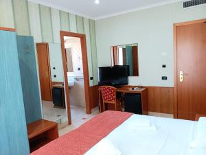 TV a/nebo společenská místnost v ubytování Hotel Riviera Fiumicino