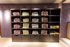 a locker room filled with shelves filled with food at KAMENOI HOTEL Kusatsu Yubatake in Kusatsu