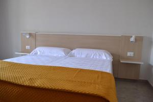 Кровать или кровати в номере B&B Coppularossa