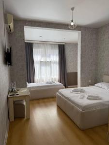 Postel nebo postele na pokoji v ubytování Hotel Old Boulvared