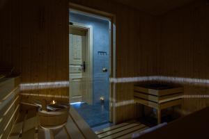 a bathroom with a tub and a sink in a room at Enklawa Natura in Kościelisko