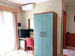 TV a/nebo společenská místnost v ubytování Hotel Riviera Fiumicino