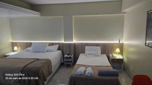 Postel nebo postele na pokoji v ubytování Royal Flat ' Hotel, unidade nº 204