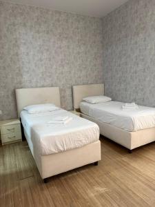 Postel nebo postele na pokoji v ubytování Hotel Old Boulvared