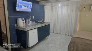 Kuchyň nebo kuchyňský kout v ubytování Royal Flat ' Hotel, unidade nº 204
