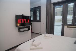 Postel nebo postele na pokoji v ubytování LED, comfort and style just a few minutes from the Colosseum