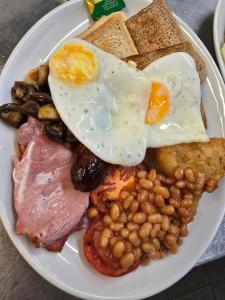 a plate of breakfast food with eggs beans and toast at Ring O Bells in St. Issey