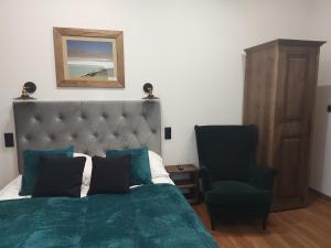 Postel nebo postele na pokoji v ubytování 4 STRONY ŚWIATA Pokoje i Apartamenty