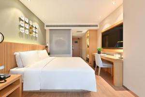 Postel nebo postele na pokoji v ubytování Atour X Hotel Nanjing West Road