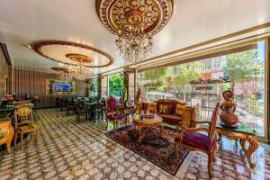 a living room filled with furniture and a chandelier at Lemis Suite Istanbul in Istanbul