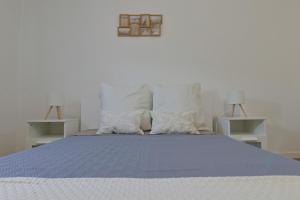 Ένα ή περισσότερα κρεβάτια σε δωμάτιο στο Maria's House