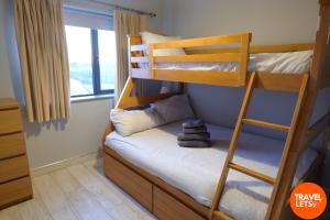 Postel nebo postele na pokoji v ubytování No 5 Sandycove