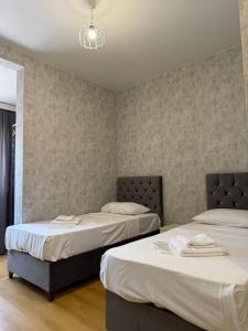 Postel nebo postele na pokoji v ubytování Hotel Old Boulvared