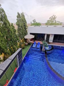 an overhead view of a swimming pool at a resort at G R A N D C H A L E T in Salalah