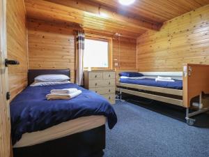 Katil atau katil-katil dalam bilik di Chestnut Lodge