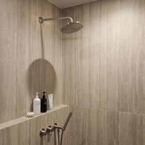 a bathroom with a shower with a shower head at Wolha in Gyeongju +50 photos