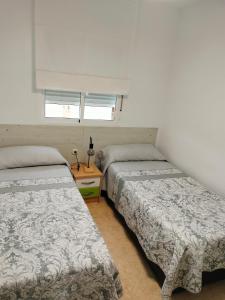 Postel nebo postele na pokoji v ubytování Alojamiento las Dunas + 24 fotografií