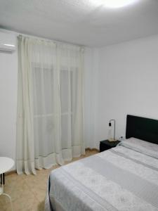 Postel nebo postele na pokoji v ubytování Alojamiento las Dunas