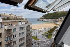 a view of a beach from a building at Playa de La Concha 7 by FeelFree Rentals in San Sebastián