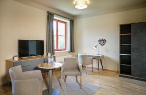 Telewizja i/lub zestaw kina domowego w obiekcie JUFA Hotel Mariazell
