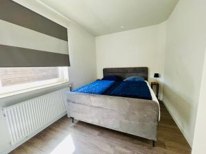 Ένα ή περισσότερα κρεβάτια σε δωμάτιο στο Lamsoor 2C