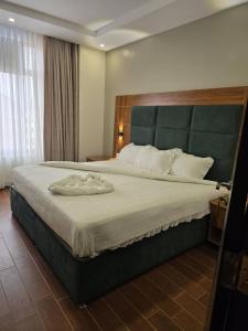 Postel nebo postele na pokoji v ubytování Jikoni Hotel
