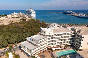 an aerial view of a hotel and the ocean at Athineon Hotel in Rhodes Town