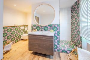 a bathroom with a sink and a mirror at Seeapartment Panorama in Gaienhofen