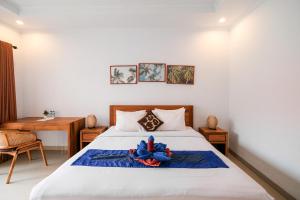 Postel nebo postele na pokoji v ubytování Bali intan Canggu + 26 fotografií