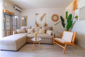 a living room with a couch and a chair at Espanatour SANTA ROSARIA in La Mata