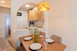 a kitchen and dining room with a table and chairs at Espanatour SANTA ROSARIA in La Mata +21 photos