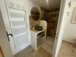 a small bathroom with a sink and a shower at Carpe Diem in Toulon