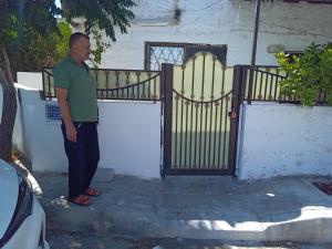 a man standing in front of a gate at Sky2 in Jerash