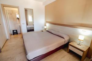Postel nebo postele na pokoji v ubytování Villa Santangelo