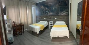 Posteľ alebo postele v izbe v ubytovaní Hostal imperio