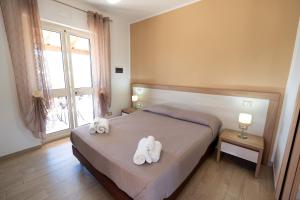Postel nebo postele na pokoji v ubytování Villa Santangelo