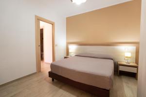 Postel nebo postele na pokoji v ubytování Villa Santangelo