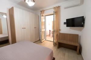 Postel nebo postele na pokoji v ubytování Villa Santangelo