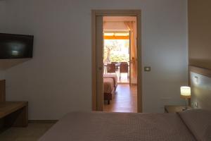 Postel nebo postele na pokoji v ubytování Villa Santangelo