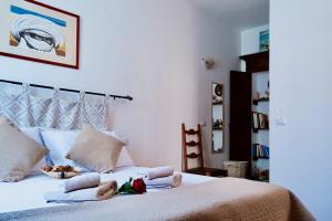 Postel nebo postele na pokoji v ubytování Minerva's Heart