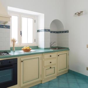 a kitchen with a sink and a counter at Sea Soul Positano in Positano +80 photos