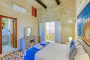 Rúm í herbergi á Girardu Holiday Home