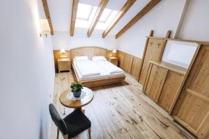 Posteľ alebo postele v izbe v ubytovaní Hotel Tenz