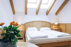 Posteľ alebo postele v izbe v ubytovaní Hotel Tenz