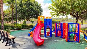 a playground in a park with a slide at Apartamentos Lagoa Quente Hotel in Caldas Novas