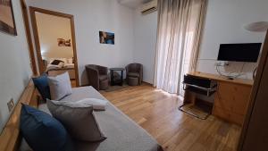 TV a/nebo společenská místnost v ubytování Hotel Del Viale