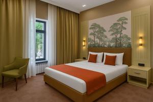 Postel nebo postele na pokoji v ubytování Nizami Central Park Hotel