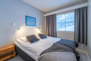 Кровать или кровати в номере Kuukkeli Apartments